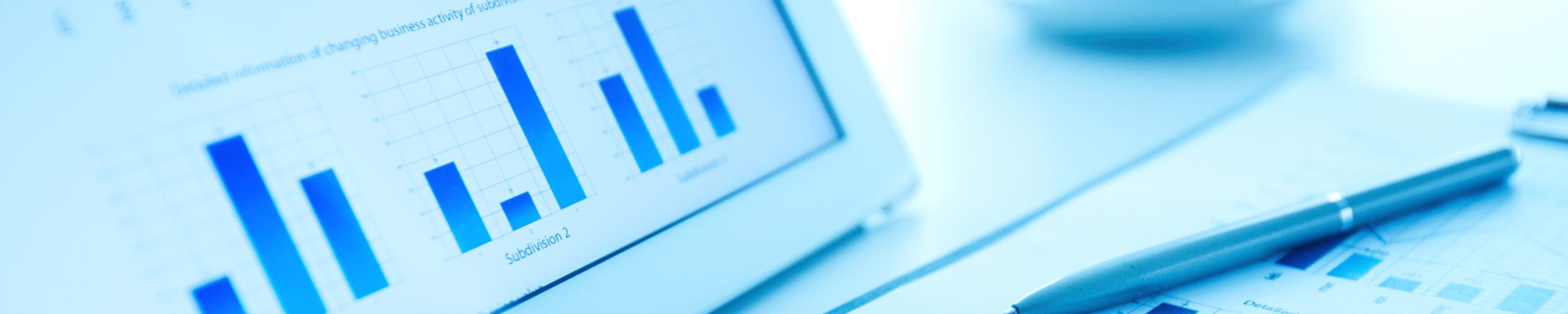 Image of workplace with paper and electronic documents and pen